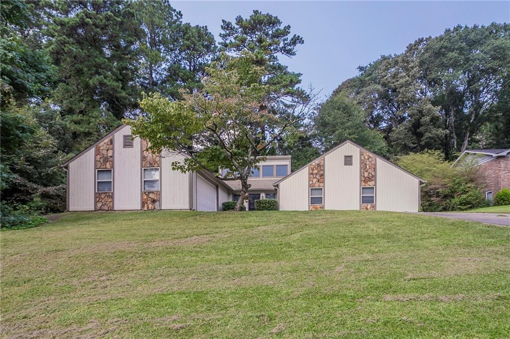 This 3BR/2BA ranch on a corner lot in the Shannon Green West community is ready for renovation. Features include vaulted ceilings in the living room, an open layout, and tons of natural light throughout. Kitchen and bathrooms need full rehab. The primary bedroom offers good space and storage, with two additional bedrooms for added flexibility. Large, level yard with mature landscaping and great curb appeal once cleaned up. Located just minutes from shopping, dining, and the Silver Comet Trail. Excellent flip or rental opportunity in a desirable part of Cobb County.