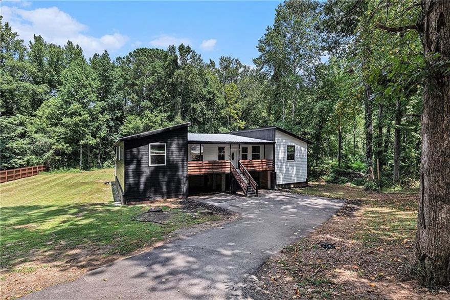 Investor Special! Home being sold As-Is! Welcome to this unique one-of-a-kind 4-bedroom, 4.5 bathroom home, with an attached in-law suite perfect for both relaxation and recreation. The expansive yard offers endless possibilities, whether you love to entertain or pursue outdoor hobbies. Inside, the open-layout kitchen is a showstopper with its modern design, brass accents, and a large island, ideal for both cooking and gathering. All bedrooms are conveniently located on the main level, with the primary ensuite featuring a luxurious soaking tub and sleek glassed shower. Enjoy outdoor living year-round on the screened-in back porch. There is a bonus room on the lower level that provides additional space, ready for you to customize into your dream area. Discounted rate options and no lender fee future refinancing may be available for qualified buyers of this home.