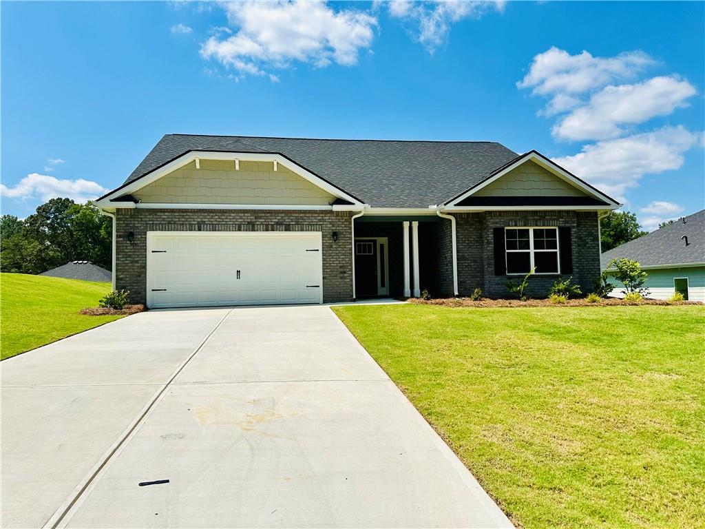 Welcome to this "Park Place Sanctuary" - A Stunning 4 Bedroom / 3 Bed Retreat in Park Place community! *Price Reflects Builder Incentive* Imagine waking up in your dream home in Park Place, affectionately known as "The Friendly City", Bowdon, GA. This beautifully crafted 2,604 sq. ft. home features 4 spacious bedrooms, 3 full bathrooms, and a thoughtful 1.5-story design with a large bonus room upstairs-ideal for a guest suite, media space, office, or playroom. From the moment you enter the welcoming foyer, you're embraced by natural light, a flowing open-concept layout, and classic finishes that make every day feel special. At the heart of the home is a stunning gourmet kitchen with a generous granite island, walk-in pantry, and seamless connection to the dining and family room-designed for both connection and comfort. The main-level owner's suite is a true sanctuary, offering a spa-like bath with soaking tub, tiled shower, dual vanities, and a spacious walk-in closet. Two additional main-floor bedrooms provide flexibility and privacy for guests or family, while the upstairs bonus space, with its own 4th bedroom and full bath, brings even more options to meet your lifestyle. Walking outside to a covered patio overlooking your private backyard oasis, ready for slow mornings, summer cookouts, or peaceful evenings. Whether hosting lively gatherings or enjoying a quiet evening, this home is designed to enhance every moment of your life. Built for quality and efficiency, "The Park Place Sanctuary" features architectural shingles for durability and two water heaters to ensure lasting comfort and peace of mind. you'll enjoy natural light throughout the day, making every room feels warm and inviting. Situated in Carroll County, minutes from I-20, local Bowdon schools, Tanner hospitals, and the University of West Georgia and West Georgia Technical College along Georgia State Routes 100 and 166, Bowdon combines small-town charm with convenient access to nearby communities, local downtown restaurants, and boutique shops. Near Carrollton Greenbelt walking trails, Little Tallapoosa, Hays Mills, and John Tanner Parks, great for outdoor life, hiking, biking, walking, boating, and fishing. USDA financing eligibility, and only $1,000 in earnest money required - this is your opportunity to own a residence that perfectly blends style, efficiency, and affordability. Schedule your private tour today and start making memories in "Park Place Sanctuary." Homes are under construction, please use caution when touring the property.