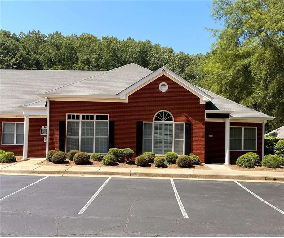 The Nash Team is proud to announce this exclusive listing located in a well-known office complex in busy Roswell, just off GA-400 at the Mansell exit, this 1,136 sq. ft. office space offers a versatile layout ideal for a variety of professional uses such as counselors, attorneys, or medical consulting. The suite features a welcoming reception area, a flexible multi-use space, a kitchenette, restroom, two standard offices, and an oversized office that was previously two separate rooms. The rear office is currently leased, providing an excellent opportunity for an owner-user who may not need the entire space. Recent upgrades include ceiling fans throughout, wooden plantation shutters, Wi-Fi enabled entry with security alarm, keypad locks on each office, soundproofed interior walls, sun-deflecting screens on south-facing windows, and R-40+ attic insulation for enhanced energy efficiency. Association fees (projected to increased to $1,100/quarter) cover all the exterior maintenance, landscaping, pest and termite control, water, sewer, and trash.