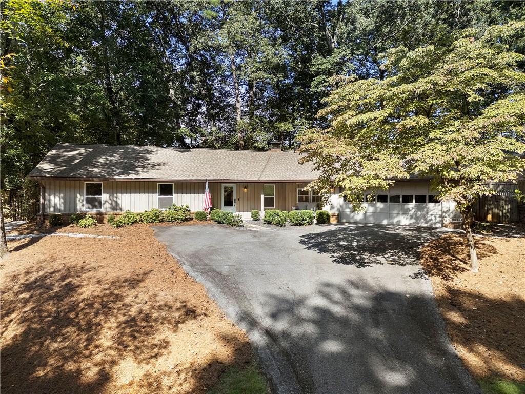 Just listed in Kingsley neighborhood in Dunwoody! This charming, completely renovated ranch is the one you've been waiting on! Walk into a dedicated foyer space and you'll immediately notice the thoughtful updates that the current owners have made during their ownership - hardwood floors throughout, recessed lighting, new interior doors and hardware. The open concept kitchen with living room makes this such a special home - the kitchen was updated with love in 2022 with gas range, custom vent hood, all new stainless steel appliances, white cabinetry, farm house sink, updated backsplash, and quartz countertops. There are 2 secondary bedrooms that share a renovated hall bathroom. The oversized primary bedroom features an en-suite bathroom (newly renovated in 2024) with Carrera marble tile, frameless shower, double sink vanity, and walk-in closet. Two generous secondary bedrooms share an updated hall bathroom. There's tons of extra storage throughout, including a dedicated laundry room/ mud room. The roof was just replaced 4 years ago. Enjoy year-round outdoor entertaining on the front porch or four season sunroom and a private, fully fenced-in backyard is perfect for your pets!