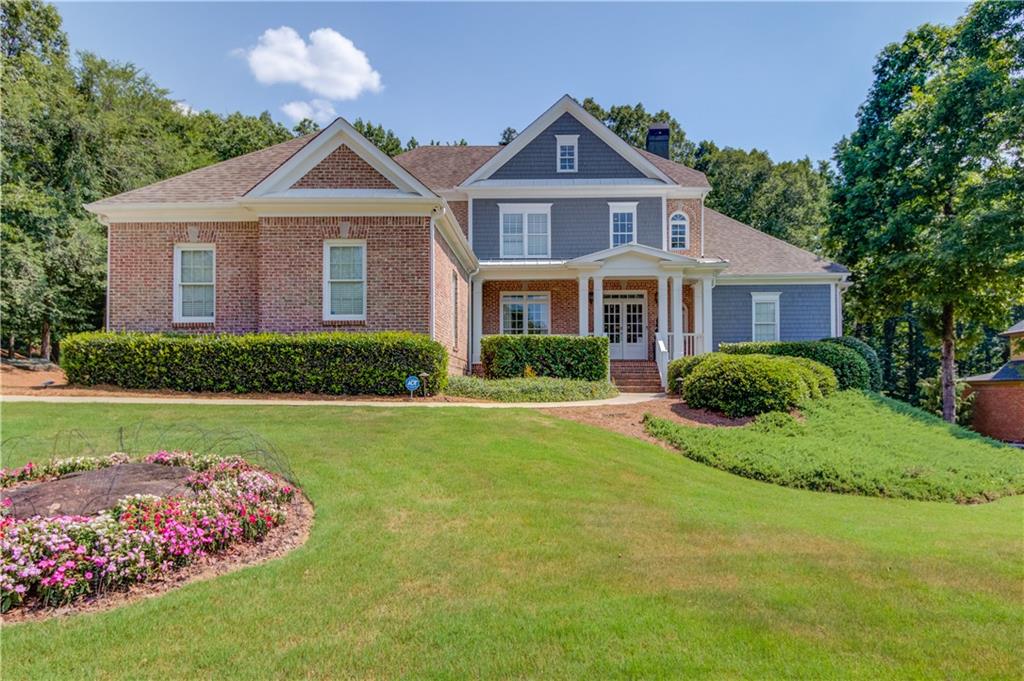 Stunning and move-in ready 4 bedroom, 4.5 bathroom home in Hoschton’s Chateau Forest community located in the Mill Creek High School District. The main level features a covered front porch, 2-story entry foyer, dining room with butler’s pantry, fireside living room with coffered ceilings and built in bookcases, eat-in chefs’ kitchen with quartz countertops, ss appliances, walk in pantry and a fireside sitting room. The owner’s suite is also on the main level and features a double tray ceiling, double vanity, soaking tub, and separate shower and large custom walk-in closet with a laundry feature. There is also a full laundry room and half bath on the main level. The upper level features 3 secondary bedrooms and 2 full bathrooms (1 ensuite and 1 jack-n-jill). The finished terrace level features a bar, game room, home theater, gym, flex room and full bathroom. Outside enjoy your own private saltwater pool with a waterfall, fire pit, and tree house tucked just inside the woods in a private 0.94 acre fenced lot. The screened in deck off the main level and covered patio off the terrace level make entertaining a breeze. Conveniently located close to the interstate, schools, shopping, dining and entertainment!