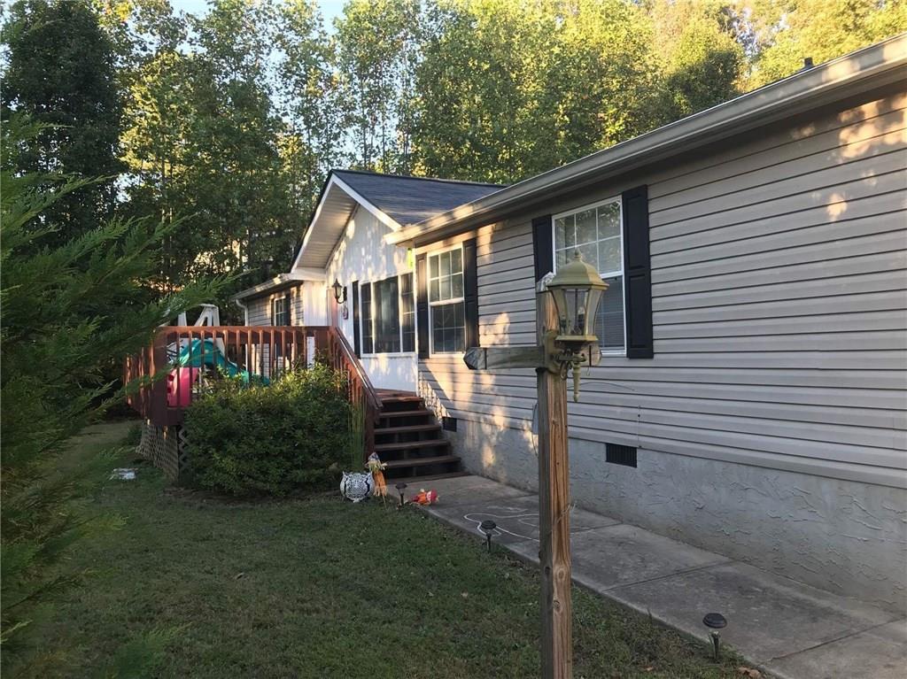 Beautiful 3 bed 2 bath spacious manufactured home on permanent foundation. Open and roomy with many features. Conveniently located 6 miles from downtown Dahlonega, 4 miles from Ga Hwy 400. Gorgeous 1 acre lot with fenced area.