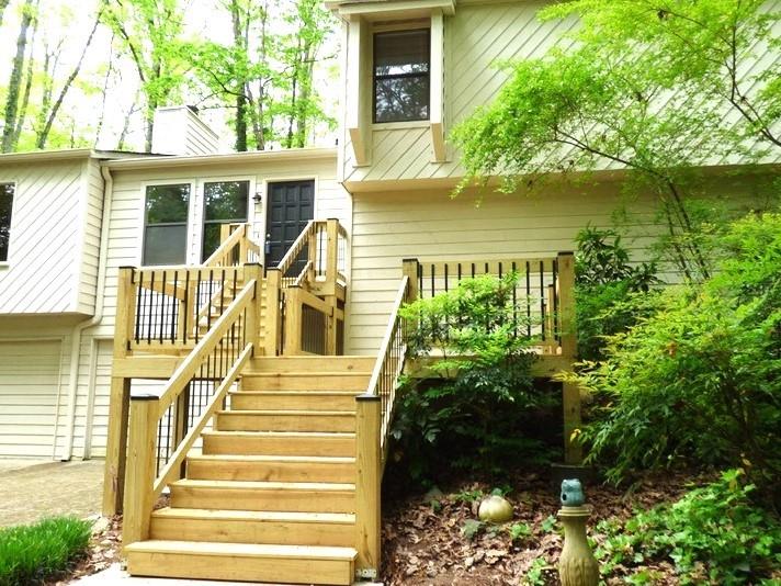 $2500 Seller Paid Closing costs!!!Location Location Location!!Check out this East Cobb home in Shallowford Heights Community and sought after Lassiter School District. Split level floorplan main level consists of an oversized family room with wood burning gas fireplace, updated kitchen with tons of cabinets, and large separate dining room You have sliding glass doors off the family room to walk out onto the back deck overlooking your private backyard. Upstairs you will find the master bedroom/ master bath and 2 generous sized secondary bedrooms and another full bath. Downstairs you will find a 4th bedroom or bonus room or in-law suite and a half bath. Laundry room is also downstairs and access to 2 car garage. Long driveway leads to tons of parking. Home has many upgrades new paint inside and outside, newer roof, updated flooring, updated kitchen cabinets, brand new front steps and new lighting. This home is move in ready. Do not miss out on seeing this one.