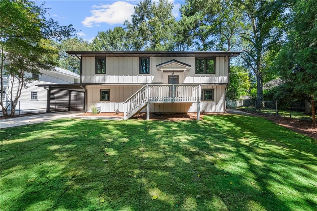 This fully-renovated Lindmoor Woods gem is designed for the discerning buyer who needs both space and connection! Completely updated including new electrical, plumbing, HVAC, hardwood floors, decking, roof, and the addition to the original footprint - the impressive, covered outdoor living deck! The main level’s open-concept living, dining, and all-new kitchen is the hub of the home — perfect for weeknight dinners, weekend gatherings, and everything in between as the flow is effortless from room to room. From here, step out onto the grand covered deck complete with an electric fireplace, vaulted ceiling, and designer lighting - the perfect spot for barbecues, cozy evenings, or morning coffee. With 5 total bedrooms, 3 full bathrooms, and 3 living spaces (2 indoors, one out) everyone has their own space here. Upstairs includes 3 bedrooms and a generous full bath with built-in storage. Downstairs, the home shines with a beautiful primary suite and an additional bedroom, an additional 3-piece bath, laundry room, and a bonus living area with a built-in mini bar — a fun spot for movie nights, game days, or anything your heart desires. The private primary suite includes a custom walk-in closet and its own full bath, offering a stylish and comfortable retreat. Heading outside on this level, you’ll find an expansive covered back patio (yes, another one!) and covered parking with direct access to the fenced backyard. Can you say - enough room for a roller derby on that shaded, concrete slab of perfection that wraps around the house?! All of this comes with the charm and community of desirable Lindmoor Woods, a wonderful neighborhood with easy access to schools, shopping, and major highways - including their optional Swim & Tennis Club - making it a place where you will feel right at home. This is truly a turn-key home that has been thoughtfully updated - ready for you to move in and enjoy!