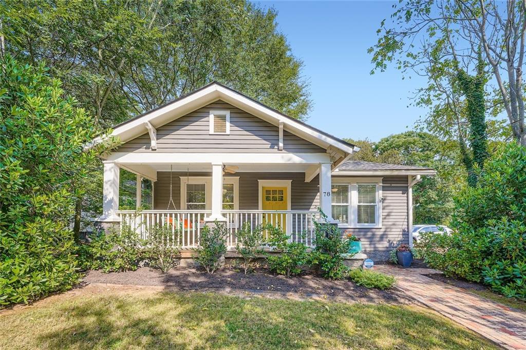 This quintessential Craftsman in Edgewood checks all your boxes. Perched on a hill on a corner lot, you are secluded from the hustle and bustle of city life. An open concept accommodates today's lifestyle without forsaking the homes original charm. Loads of natural light, hardwood floors throughout, high ceilings and original finishes. Three generously sized bedrooms and two recently updated bathrooms. The primary suite has vaulted ceilings, custom closets and french doors leading out to the back patio. The front bedroom is ideal for a home office and is outfitted with builtin bookshelves and generous storage. Much attention and thought has been put into the front and back yard. New pavers and pathways and a redesigned patio deck off the back of the house. The current owner has used her green thumb to create a lush garden oasis. Other updates include fresh paint, new light fixtures and window treatments and a new roof and gutters. There is private gated parking off the back of the house and a large shed for all your weekend projects. If you want walkability, look no further. 78 Whitefoord is two blocks from El Tesoro, the Trolly line/Beltline and Coan Park. Easy access I-20 and all major highways, Edgewood shopping district, etc.
