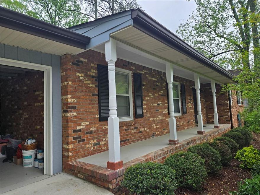 Discover the epitome of easy living in the heart of East Cobb! This well-maintained brick ranch offers a rare stepless layout, ideal for accessible and comfortable living. Featuring 4 bedrooms and 2 full bathrooms, the home blends classic charm with practical design. Step into a formal living room that flows into a cozy family area, connected seamlessly to the kitchen-creating a warm, central space for daily life and entertaining. The spacious dining room is perfect for hosting gatherings, while the private backyard provides a peaceful retreat for outdoor enjoyment. The primary suite offers an en suite bath and a calm escape, while three additional bedrooms provide flexibility for guests, family, or a home office.