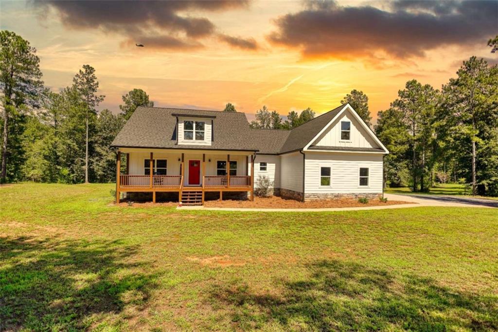 Built in 2021, this stunning 3-bedroom, 2.5-bath home offers modern living on 5 private acres. With 2,348 sq. ft. of finished space and an additional 266 sq. ft. expandable attic stubbed for a full bath, there's room to grow and make it your own. The inviting split-bedroom plan ensures privacy for the owner's suite while keeping secondary bedrooms conveniently nearby. Enjoy an open-concept living area with plenty of natural light, stainless steel appliances, and stylish finishes throughout. Outside, the expansive property provides endless opportunities - from gardening to outdoor entertaining - all while giving you the space and privacy you've been looking for. This move-in ready home combines the comfort of modern construction with the freedom of country living - just waiting for its next chapter.
