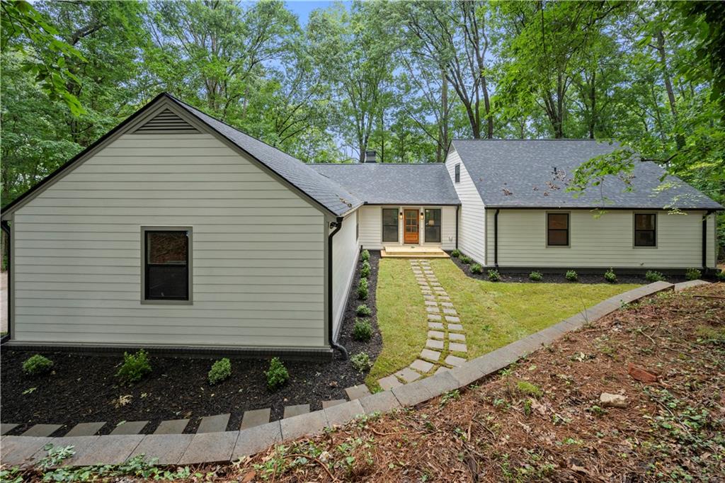 Discover peaceful living in this beautifully updated 6-bedroom, 4-bathroom ranch over basement, nestled on 2.2 private acres in a quiet cul-de-sac with scenic views. Located in the highly sought-after Harrison District and just minutes from shops and restaurants, this home offers the perfect blend of comfort, space, and convenience.
Step inside to find a thoughtfully designed layout featuring hardwood floors, a master suite on the main level, and an oversized kitchen with a walk-in pantry, perfect for entertaining. A mudroom off the entry adds practicality to everyday living.
The finished basement includes a full in-law suite with kitchenette, plus bonus living and storage space—ideal for multi-generational living or guests.
Major updates include a new roof, new septic system, new plumbing, new HVAC systems, new electrical, and new energy-efficient windows, giving you peace of mind for years to come. The property is nicely landscaped, includes an EV charger, and is surrounded by a friendly neighborhood that has no HOA restrictions.
With its spacious layout, modern upgrades, and serene setting, this home is a rare find in one of the most desirable areas of West Cobb.