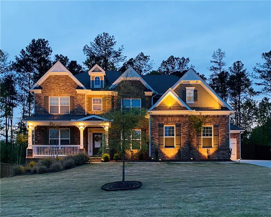 Located in one of Woodstock’s most sought-after neighborhoods and just minutes from vibrant downtown, this stunning home blends comfort, functionality, and style—zoned for River Ridge High School ranked 9 out of 10 and in the top 20% of high schools in Georgia!! Step inside to find soaring ceilings and gleaming hardwood floors throughout the main level. The two-story great room is filled with natural light from floor-to-ceiling windows and flows seamlessly into the kitchen, complete with granite countertops, stained cabinetry, and a spacious island—perfect for entertaining. A formal dining room adds elegance, while the unique feature of two offices perfect for dual remote workers or anyone needing flexible spaces for productivity and creativity.
Guests will love the convenience of a main-level bedroom with a full bath. Upstairs, the oversized owner’s suite features a spa-like bathroom and direct access to the laundry room. Three additional bedrooms include one with a private en-suite and two connected by a Jack-and-Jill bath.
The home also boasts a full, unfinished daylight basement with walk-out terrace level—ready for your personal touch. Outside, enjoy upgraded exterior lighting and an extended upper (with grilling area) and lower deck overlooking the fully fenced backyard, perfect for play, pets, and gatherings. A three-car garage and oversized driveway provide plenty of parking.
One year temporary buydown offered with preferred lender will lower interest rate by 1% and payment up to $500/month! 
Don’t miss your chance to own this beautiful Woodstock home—schedule your showing today!