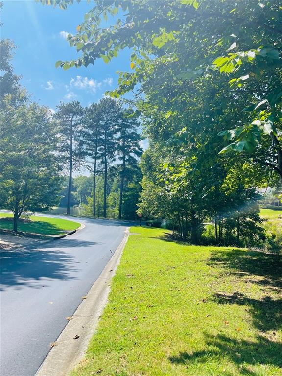 What a beautiful approach to your new lot. Enjoy a quiet, peaceful drive, as you cross the bridge, taking in stunning lake and golf course views. A quick left turn and you're home. With 1+ acre lots, each home site is private and offers ample space to create your own peaceful retreat while still enjoying a sense of community. Come experience the magic of Hawks Ridge. You'll be glad you did.