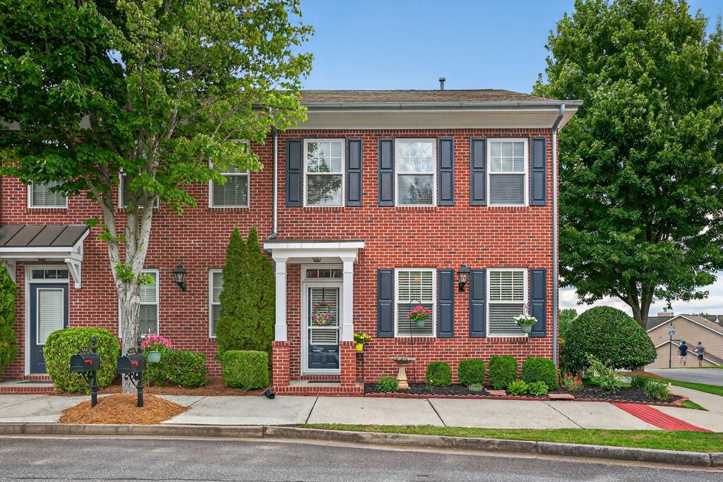 WELCOME HOME TO A CHARMING TWO STORY "LIKE NEW" ORIGINAL OWNER!! TOWNHOME IN THIS HIGHLY SOUGHT AFTER SUWANEE NEIGHBORHOOD IN GWINNETT COUNTY. THIS HOME IS ABSOLUTELY MOVE-IN READY! OFFERING CONVENIENT ACCESS TO TOP-RATED SCHOOLS, AN ABUNDANCE OF SHOPPING AND DINING OPTIONS, SCENIC WALKING TRAILS, SUWANEE TOWN CENTER PARK AND EASY COMMUTING TO MAJOR HIGHWAYS. FROM THE MOMENT YOU ARRIVE, THE HOME'S INVITING CURB APPEAL STANDS OUT...STEP INSIDE TO A FAMILY ROOM FLOODED WITH NATURAL LIGHT THANKS TO AN UPGRADED STORM DOOR, WHILE A COZY ELECTRIC FIREPLACE ADDS WARMTH AND CHARM. THE DINING ROOM, ADORNED WITH JUDGES PANELING FLOWS SEAMLESSLY INTO THE KITCHEN FEATURING SLEEK HARD SURFACE COUNTERTOPS W/ STACK STONE BACKSPLASH. CROWN MOLDING THROUGHOUT THE LOWER LEVEL ADDS SOPHISTICATION WITH AN UPGRADED HALF BATH*KARASTAN LVP FLOORING*42" STAINED KITCHEN CABINET*ALL KITCHEN APPLIANCES TO STAY INCLUDING: NEW STAINLESS-STEEL KITCHEN-AID (VERY QUIET) DISHWASHER, GAS STOVE AND EVER SO QUIET INSINKERATOR*UPGRADED ELECTRIC PROGRAMMABLE FIREPLACE W/ BEAUTIFUL STONE SURROUND AND HEARTH COMPLETES THE MAIN LEVEL. UPSTAIRS, RETREAT TO A SPACIOUS PRIMARY SUITE COMPLETE WITH DOUBLE TRAY CEILINGS, AND A SITTING AREA. THE WELL-APPOINTED BATHROOM BOASTS A SOAKING TUB, A WALK-IN SHOWER AND LARGE CLOSET. TWO ADDITIONAL BEDROOMS, AND A CONVENIENT UPSTAIRS LAUNDRY ROOM, UPDATED CEILING FANS IN ALL THE BEDROOMS, MOHAWK SMART STRAND CARPET W/SUPERIOR STAIN PROTECTION, UPPER-LEVEL UPDATED LENOX HVAC UNIT AND TILE IN ALL UPPER-LEVEL BATHROOMS, ROUND OUT THE UPPER FLOOR. ADDITIONAL UPGRADES INCLUDE: *NEW BRADFORD WHITE ELECTRIC 50-GAL WATER HEATER*PRO SYSTEMS "SOFT WATER" SOFTENER*NEWLY PAINTED EXTERIOR*BEAUTIFULLY LANDSCAPED SIDE YARD. BEST OF ALL, YARD MAINTENANCE (LAWN MOWING), TERMITE BOND, AND INSURANCE FOR THE EXTERIOR OF BUILDING ARE INCLUDED IN THE HOA FEE, ALLOWING YOU TO ENJOY YOUR HOME, NEIGHBORHOOD POOL, AND THE VIBRANT COMMUNITY AROUND YOU FULLY. THE NEIGHBORHOOD'S PRIVATE WOODED NATURE PATH ALLOWS YOU TO MAKE YOUR WAY TO TOWN CENTER AND VISIT THE FARMERS MARKET, THE 1200-FOOT PEDESTRIAN BRIDGE OR WATCH A CONCERT AT THE AMPHITHEATER. PLAYTOWN SUWANEE FEATURES A MASSIVE 13,000 SQUARE FOOT PLAY AREA WITH FOSSIL DIG ZONE, SAND VOLLEYBALL COURTS AND WATER FEATURES. TOP RATED ROBERTS ELEMENTARY (9/10) AND NORTH GWINNETT (9/10) SCHOOLS ARE ALL WITHIN 3 MILES. DON'T MISS THE OPPORTUNITY TO MAKE THIS BEAUTIFULLY MAINTAINED HOME YOURS, WHERE STYLE, LOCATION, AND LOW-MAINTENANCE LIVING COME TOGETHER PERFECTLY