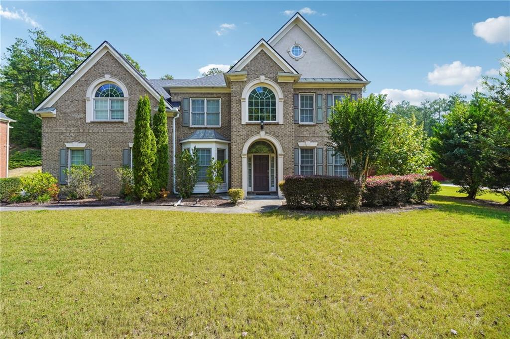 Spacious traditional 3 sided brick home, nestled in the established and desirable neighborhood of Walden Park. Home has 4 bedrooms, 2.5 baths with a side entrance 2 car garage and sits on a nice flat lot.
The inviting entryway exudes an elegant ‘feel’ as you cross the threshold and step into the two story foyer. To the right you will find a sitting room that can be used as a home office, library, piano room, or outfitted to suit your personal needs. On the opposite side is the dining room, which flows directly into the ‘open concept’ kitchen complete with center ‘island’ and ‘bar’ seating.
With unobstructed views to the two story living room and backyard it’s easy to maneuver from one area to the next making family gatherings and light entertaining ‘a breeze’. The wall of windows in the living room not only adds an elegant touch, it allows for lots of light to naturally flow into the space. Additional features on the main level include a fireplace with ‘built in’ shelving surround; wainscoting, baseboards and trey ceiling.
Upstairs this home offers 4 spacious bedrooms which includes an oversized owners suite with a spa-like ensuite bathroom.
Walden Park is the ideal neighborhood to call ‘home’ with tree lined sidewalks throughout the community and very well located. Subdivision amenities include a clubhouse, pool, playground, tennis and basketball courts Additional area amenities include Boundary Waters Aquatic Center, Wolf Creek Amphitheater, Wolf Creek Golf Course and Welcome All Park & Multipurpose Facility. Easy access to I-285, and convenient to Camp Creek Marketplace, Hartsfield Jackson Airport.
