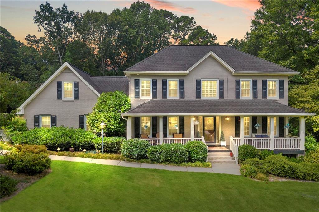 Gorgeous traditional all brick home in award winning Brookwood School District! This house welcomes you in, it is warm, inviting, and feels like home. Front and rear staircases lead you to four spacious bedrooms and an office area on the second floor. Amazing bonus space on 3rd floor offers abundant storage. Kitchen features SS appliances, wall oven, gas cooktop, solid surface countertops, kitchen island and eat in breakfast area. Separate dining & living room, great flow on the main level. Primary suite offers a spacious spa-like bath, dressing area and enormous walk in closet. Extra large secondary bedrooms will make everyone happy. Finished basement has endless possibilities including a workshop, playroom, theater, or extra bedroom. Newer triple paned windows and plantation shutters throughout. Welcoming sun room leads to custom fieldstone patio with wrought iron gate. The outdoor area offers a refreshing pool, hot tub and expansive decking, making this the perfect entertainment space. Stunning front porch with leaded glass door provides an amazing view of the professionally landscaped, lush yard. Fenced back yard, newer driveway, EV hookup, pocket doors and central vac are just a few of the extras that make this house so special!