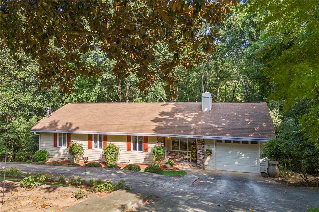 Nestled among the trees, this beautiful 4-bedroom, 3-bath home offers both privacy and character on a spacious 0.55-acre lot with no HOA.
The main level features 3 bedrooms and 2 baths, along with bright sun-filled windows that fill the living spaces with natural light. The finished basement provides a fantastic opportunity for a private in-law suite or teen suite, complete with a full kitchen, 1 bedroom, and 1 bath.
With 1,596 sq. ft. of living space, this home offers room to grow and enjoy. Whether you’re relaxing on the property surrounded by nature or taking advantage of the basement’s separate living quarters, this home is full of possibilities.