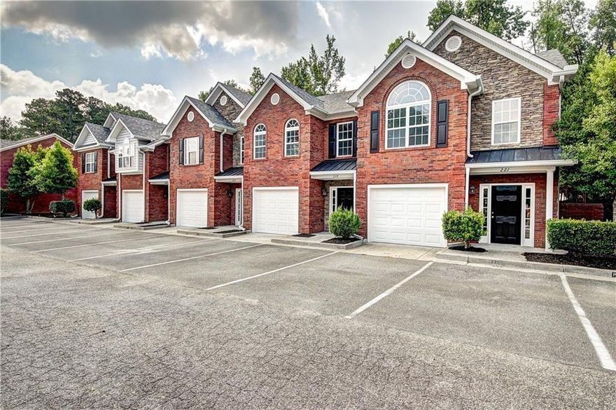 PRICE IMPROVEMENT plus $2000 Lender CREDIT.  Located just minutes from the lively charm of Downtown Woodstock, this END-UNIT townhome sits within an enclave of only 13 residences.
The well-designed, open floor plan has luxury vinyl flooring, fresh alabaster walls with crisp white trim.  The light and airy kitchen has granite countertops, stainless steel appliances, a generous pantry, and a deep breakfast bar that doubles as an island—seamlessly connecting to the living and dining areas through a graceful arched entryway.
Upstairs, you'll find two oversized bedrooms, including a stunning primary suite bathed in natural light. The en-suite bathroom has a walk-in shower with frameless glass doors, modern tilework, and a granite-topped vanity.
Out back, you have a fenced yard with a large patio and privacy screens.  Tucked away as both an end-unit and at the street’s end, this home offers a uniquely peaceful and private setting.
In addition to the single car garage, there are 2 assigned parking spaces directly in front of the unit along with guest parking. 
This meticulously maintained home offers elevated living in a sought-after location. Must use preferred lender for credit.