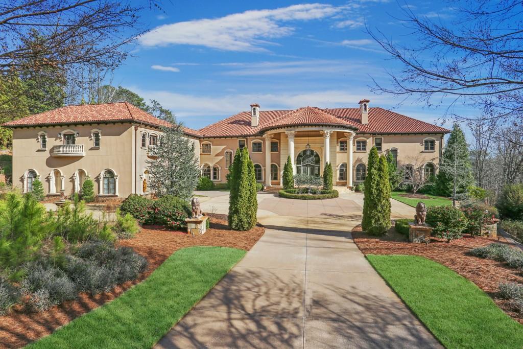 Expansive, luxury Mediterranean estate on 3.4+/- acres. You are welcomed to this 26,000+/- home by 18-foot iron front doors which lead to the stunning two-story foyer and double staircase. The home features 8 bedrooms, 8 full- and 4 half-bathrooms, gourmet kitchen, two-level, paneled library, master suite on main, terrace level complete with bar, custom media room, wine cellar, cigar room, elevator, 8-car garage and large in-law suite with separate entrance. The outdoors will impress you with total privacy, a stunning skyline view of the city, heated saltwater pool and spa and putting green. The home also features Creston lighting control, security system, cameras and a whole house generator.