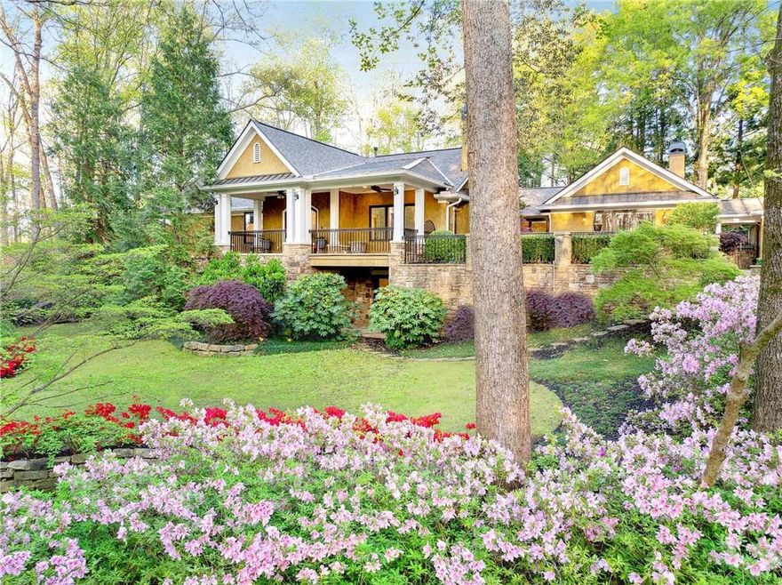 Exclusive and private estate on approximately 9 acres of breathtaking property. Own a slice of heaven at this sanctuary residence, offering a 4-bedroom main home, luxurious pool house, professional equestrian facilities with 4-stall stable and lighted dressage arena, over 7 acres of manicured gardens and landscaping, natural creek frontage, multiple waterfalls, 4 serene ponds, garages for 10+ vehicles, and a showpiece climate-controlled greenhouse. With more than a dozen thoughtfully designed structures—including a guest barn apartment, chapel, pavilions, and extensive entertaining spaces—this estate is a rare blend of lifestyle, beauty, and functional luxury.

The main residence spans 3,975 sq ft and includes 4 bedrooms, 3.5 bathrooms, and 2-car attached garage. Recent upgrades include two new hot water heaters (2023 and 2025), HVAC systems (2024), and a new roof with upgraded insulation (2020). Interior highlights include a Viking range, jetted double-sized Jacuzzi tub in the primary suite, central vac, home theater, and mirrored gym.

The 1,620-square-foot pool house serves as an entertainer’s dream, with loft-style bedrooms and a chef’s kitchen outfitted with Wolf appliances, warming drawer, 2 dishwashers, 2 microwaves, and custom refrigeration drawers. A central bar with cabinetry, dishwasher, ice machine, and a 25-foot dining table sets the stage for large gatherings. The 55,000-gallon gas-heated UV-ozone pool (no salt or chlorine) includes 3 in-pool benches, 2 waterfalls, and an in-ground cleaning system. The pool was resurfaced in 2018, with a new heater and filter added in 2022.

The equestrian facility features a 4-stall stable with climate-controlled tack room and office, separate shavings shed, feed room, 2 hot/cold water wash racks, and a fly spray system. The lighted 60’ x 100’ dressage arena offers excellent drainage, sprinklers, and all-weather footing. 7 fenced paddocks and pastures, 3 with run-in sheds, connect to over a mile of private horse and walking trails.

The barndominium offers a flexible 1,685-square-foot layout with acid-stained garage flooring on the main level, space for two vehicles or as a party barn, plus a built-in bar. Upstairs, a guest studio apartment opens to a deck overlooking the arena. Both levels feature vintage-style refrigerators.

Constructed in 2019, the estate’s chapel includes stone benches, a wishing well, gardens, and an observation deck with mountain views. The climate-controlled greenhouse complex is a showstopper—ideal for any Master gardener—with two high-end structures connected by a cedar-lined atrium with skylights, low-E glass, motorized hydraulic roof vents, HVAC, and automated watering. A koi pond, waterfalls, and olive tree orchard bordered by stone walls surround the space.

Systems include 108+ irrigation zones fed by two deep wells, app-controlled lighting, irrigation, security, and audio, and solar panels generating up to 30 kWh monthly. Nearly 60 security cameras monitor the grounds, while Sonos audio plays across 12 outdoor zones. Landscape lighting includes 50 moonlights and path uplights for evening ambiance.

Also included: a detached 7-car garage with storage loft, finished tool shed with workspaces, two large dog runs (indoor and outdoor), playground, hot tub, and a chicken coop. Outdoor entertaining includes a lighted pavilion with bar, outdoor TV, adjacent catering kitchen, and a regulation-size bocce court with scoreboard.

The Creek Garden features 3 gazebos, 10 contemplative garden areas, stone benches, a waterfall, and interconnected trails. A climate-controlled outhouse with skylight, storage buildings, and trailer parking meet every need without sacrificing beauty.

This is more than a home—it’s a living, breathing work of art designed for elegant living, grand entertaining, and serene escape. Properties offering this depth of design, privacy, usable land, and quick access to Atlanta and Buckhead are nearly impossible to find.