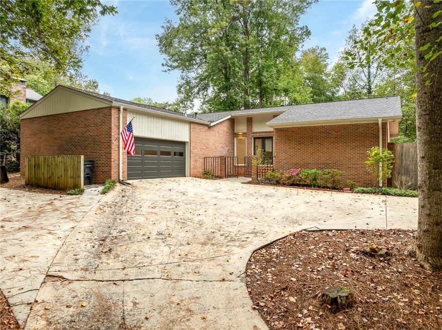 This 4-sided brick ranch was completely rebuilt in 2018 and is better than new. Featuring an open floor plan, quartz countertops, custom cabinetry, farmhouse sink, stainless appliances, and a floating hood over the gas range, the kitchen is a dream. Spacious bedrooms and spa-like baths with frameless glass showers and custom vanities make this home shine. Updates include newer roof, AC, vinyl windows, spray foam insulation, and encapsulated crawlspace. Step outside to your private fenced oasis with year-round landscaping, a 4-seasons room, and powered workshop, all in a beautiful neighborhood with no HOA, top-rated schools, and just minutes from downtown Kennesaw, Acworth, and Marietta. Don't wait-this one won't last!