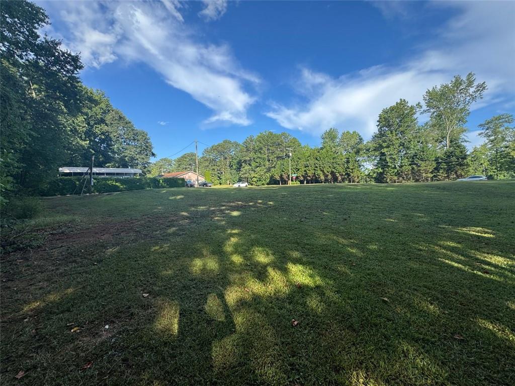 4159 Birch Bark Way, Douglasville, GA 30135 – Cleared Residential Lot, No HOA, Build your dream home or rental on this ready-to-go corner lot in a Douglasville. The lot is fully cleared with all utilities available—no timber, no prep work, and no HOA restrictions. Enjoy the quiet charm of a residential area with convenient access to shopping, great schools, and I-20. It’s a perfect blend of privacy and accessibility, just far enough from the highway for peace and quiet, yet close enough for an easy commute. Whether you’re looking to build a forever home or an income property, this lot offers great potential in a prime location. Secure your piece of the American Dream today!