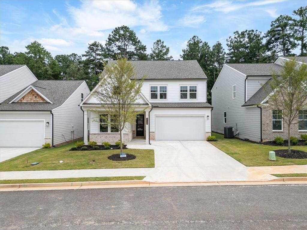 Stunning brand-new construction in one of Lilburn's most desirable neighborhoods! This 2025-built Maisee Plan offers 5 bedrooms and 3 full baths with an open-concept design. The main floor features a bedroom and full bath, perfect for guests or multi-generational living. Gourmet kitchen with stainless steel appliances, quartz countertops, and large island flows seamlessly into spacious living and dining areas. High-end luxury vinyl flooring throughout the main level, offering durability and style. The luxurious owner’s suite boasts an oversized walk-in closet and a spa-inspired bath. Located in the highly sought-after Parkview School District, with easy access to shopping, dining, parks, and major highways. This home blends modern elegance with functional design— This is a rare opportunity to own a brand-new home in an unbeatable location. Don’t miss out—schedule your showing today!