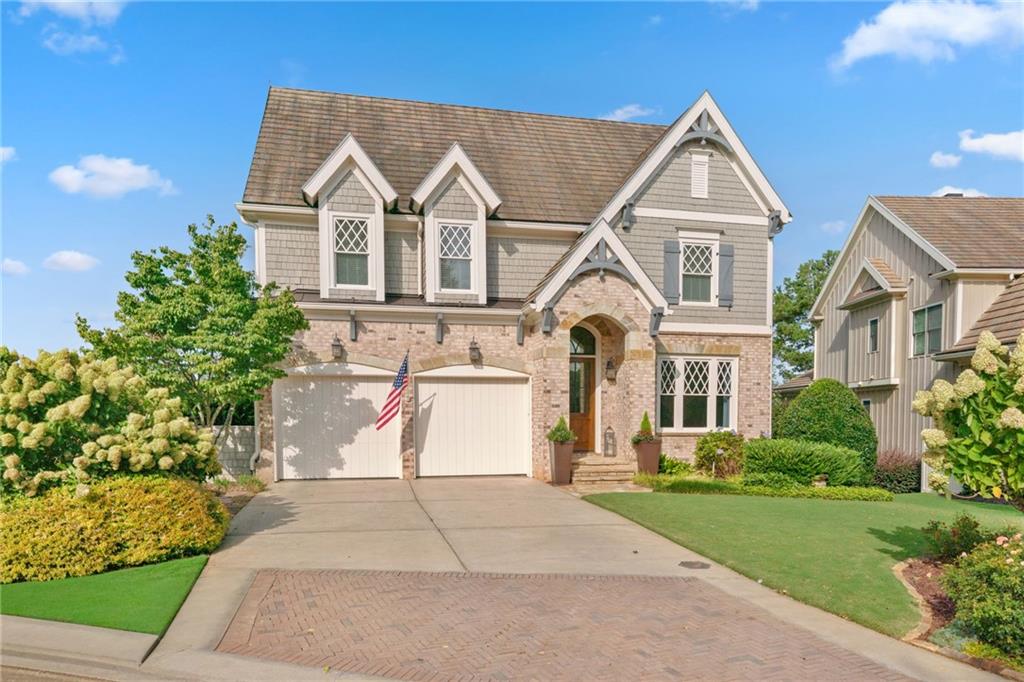 Discover a rare opportunity in the Cottages at Creekstone—this extraordinary 5 bedroom, 4.5 bath home is tucked away on one of the community’s most picturesque lots, offering the perfect balance of elegance and comfort. The original owner has invested in over $100,000 of improvements throughout to make this home extra special including a brand new kitchen with quartz countertops and gold hardware accents! Sunlight fills every room through soaring windows, showcasing the open, airy design and white kitchen that seamlessly connects to the fireside family room with custom lighted bookcases. The main-level master suite is a serene retreat, while the spacious upstairs bedrooms ensure everyone has room to unwind, with laundry on both levels for ultimate convenience. The daylight basement expands the living space with a bedroom, full bath, kitchenette and media room that opens to a covered screened patio with a dry-deck ceiling above, overlooking a beautifully landscaped, fenced backyard—complete with outdoor fireplace and fire pit, ideal for entertaining or quiet evenings under the stars. This home is move-in ready! Cottages at Creekstone is the only community that shares Creekstone Estates’ coveted 5-star amenities and an unmatched South Forsyth location near Halcyon, The Collection, hospitals, major highways, and the future Gathering at South Forsyth, this home invites you to live the lifestyle you’ve been dreaming of in South Forsyth!