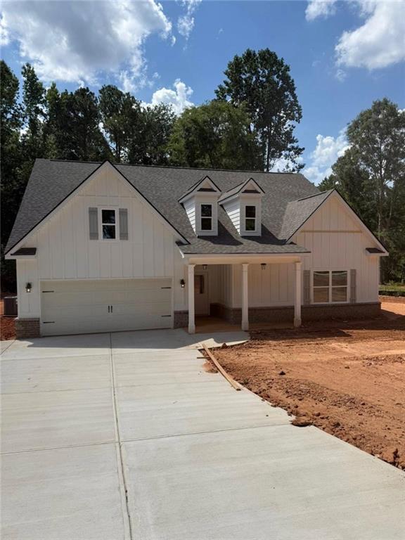 Experience peaceful living in this brand-new 4-bedroom, 3-bath ranch-style home nestled on 1.8 acres in beautiful Jackson County. With 2,929 square feet of open-concept living, this thoughtfully designed home features a spacious front and backyard, professional landscaping, and a wooded backdrop for added privacy. Enjoy a light-filled open floorplan with the primary suite conveniently located on the main level, complete with oversized walk-in closets and a beautifully tiled master bath. Modern finishes, generous living spaces, and a seamless indoor-outdoor flow make this home perfect for both everyday comfort and entertaining. Move-in ready and built for easy living-your dream home awaits. *Professional photos will be uploaded Friday* *Wells are producing more than enough water for large family*