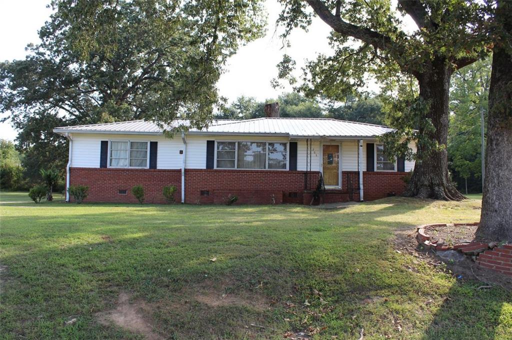 Don't miss out on this one! This three bed, two bath home has hard floors throughout and a larger utility room for your laundry and pantry area. Plenty of oppurtuntiy to renovate and make this house your home! Large, flat backyard with a longer driveway and two car carport. The carport area has a storage room that used to be the laudry area. This is a great place to store extra decorations and tools. Check this one out today!