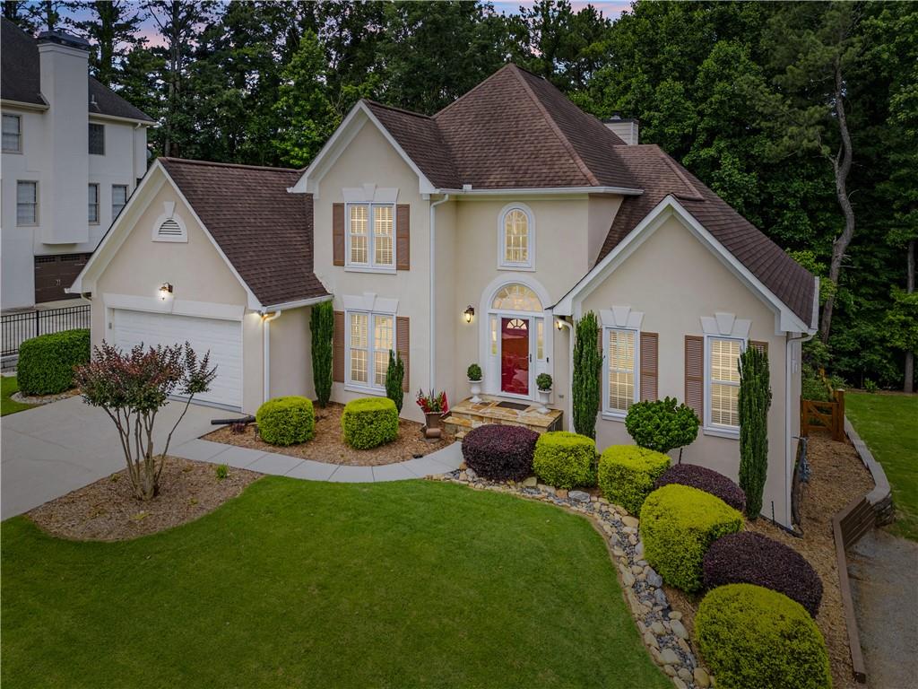 Luxury living awaits in this meticulously maintained home—perfect for the discerning buyer with impeccable taste. 3-Bed, 2.5-Bath Home with Primary on Main, Finished Basement & Award-Winning Curb Appeal.
Welcome to this beautifully maintained home in the highly sought-after Medlock Bridge community, ideally located in the heart of Johns Creek/Alpharetta. Offering 3 bedrooms, 2.5 bathrooms, and a finished basement, this home blends comfort, style, and functionality—perfect for modern living.
The main-level primary suite offers convenience and privacy, while the light-filled living spaces flow seamlessly for everyday living or entertaining. One of the home’s standout features is the custom-built 425 sq. ft. cedar screened-in porch—a serene, all-seasons retreat that brings the outdoors in while providing shelter from the elements.
Freshly painted exterior siding on the back and side adds to the home’s already impressive curb appeal. Low-E double-pane windows with a limited lifetime transferable warranty enhance both energy efficiency and peace of mind. The meticulously landscaped yard has been awarded the "Yard of Excellence" by the Medlock Bridge HOA three years in a row—a true testament to pride of ownership.
The finished terrace offers versatile living space with the potential to add a bathroom and create up to two additional bedrooms, a home office, media room, or flex space to suit your needs. Additional highlights include a fenced backyard, built-in closet and garage storage systems for organized and ample storage, a home security system, and professional landscaping that enhances the home’s curb appeal. Enjoy gleaming hardwood floors, a stunning all-season cedar-covered porch, a dedicated grilling deck, and an inviting under-deck outdoor living area off the terrace level—perfect for relaxing or entertaining year-round.
Community Amenities Include:
Two clubhouses
Two junior Olympic swimming pools
Youth and adult swim teams
Tennis and pickleball courts
Active tennis leagues
Holiday-themed events and HOA-sponsored activities
Medlock Bridge is more than a neighborhood—it’s a vibrant, active lifestyle in a top-tier school district and close to top shopping, dining, and entertainment.
Don’t miss your chance to own this thoughtfully updated home full of charm, character, and community spirit. Schedule your private showing today!