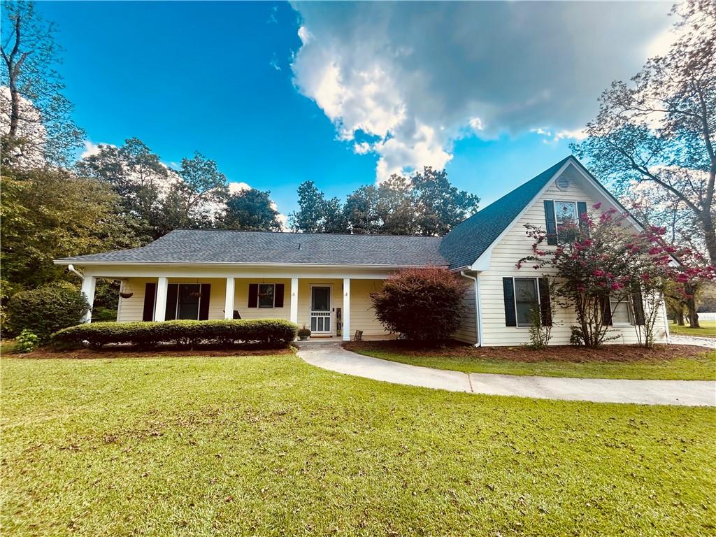 Welcome to your new home! Charming 4 bedroom 2 bath Ranch Style retreat on 3.59 acres nestled amid mature pecan trees in the peaceful McIntosh Orchards neighborhood. Spacious and Open layout: The country front porch opens into a large foyer, leading to a great room with a cozy fireplace. Chef-ready kitchen with a large walk-in pantry with plenty of space for storage and entertaining. Master Suite Retreat featuring a bonus office area (or flex space) his & her walk-in closets, double vanity and a whirlpool tub. Bonus/4th Bedroom upstairs-ideal for guests, a home office, or multi-generational living. Additional living space. Great sunroom provides extra light and connection to backyard nature. Beautiful natural surroundings with mature magnolia tress and pecan trees adding charm and privacy. Horse-friendly property. Features 2 fenced pastures for your animals. Workshop/Detached Building - great for a hobby, tools or extra storage. Handicap accessible thoughtfully designed entrance and accessibility features. This home is perfect for families who want space to roam, privacy and room for animals. Buyers who need a home office or versatile bonus space. Those looking for charm, character, and country living with city conveniences nearby. Newer Roof and HVAC approximately 3 years old