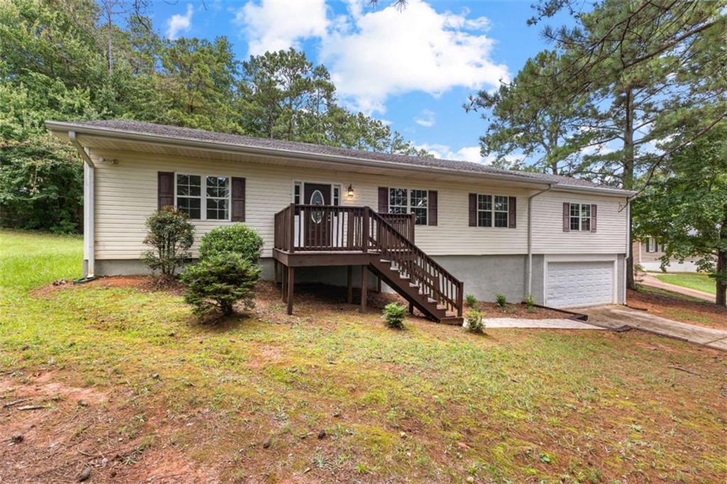 MOTIVATED SELLER! If you're looking for an AFFORDABLE HOUSE in the CENTRAL SCHOOL DISTRICT, welcome home! Complete with THREE BEDROOMS, TWO BATHS, a GARAGE, and DECK, this RANCH HOME is sure to please. Enjoy the PRIVACY offered in this partially wooded lot. REST on the DECK, while your kids play in the BACK YARD. Benefit from a BRAND NEW SEPTIC SYSTEM, NEW WATER HEATER, RECENT ROOF, NEW DINING ROOM FLOOR, FRESH PAINT, NEW BATHROOM TILE, AND NEW FAUCET. Preinstalled GUTTER GUARDS and an active TERMITE BOND make for lower maintenance. Lots and lots that is NEW! Come CHECK IT OUT TODAY!