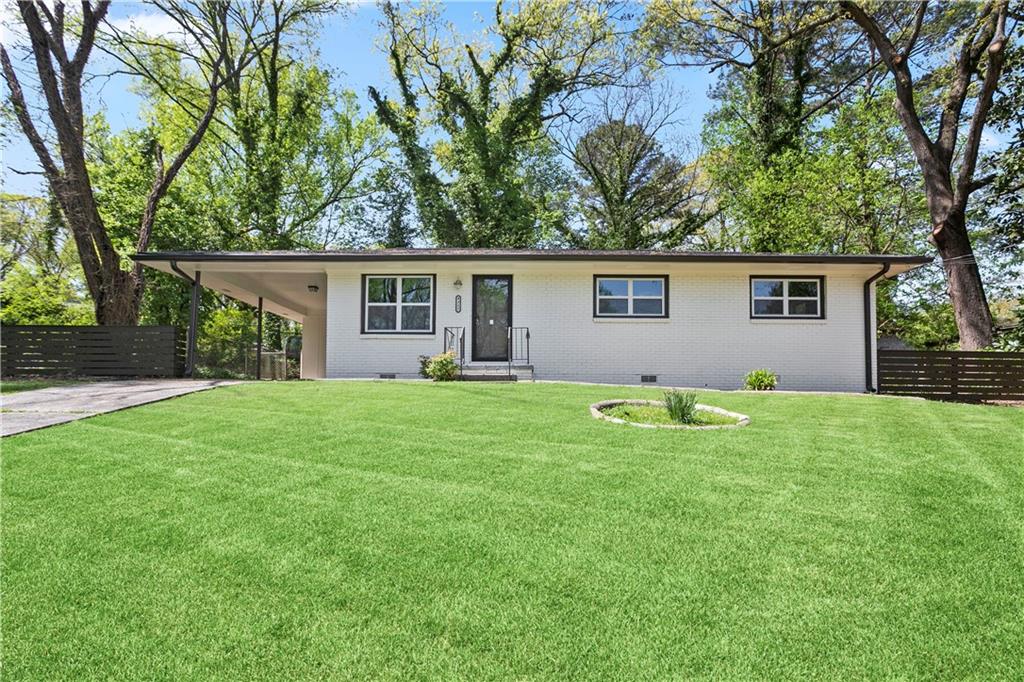 Gorgeous renovation in quiet Brookside Park. Open the front door to gleaming hardwood flooring and tons of lighting throughout. Entertain friends and family in the open concept living, dining & kitchen. Whip up delicious meals in this dreamy kitchen with sparkling granite countertops, new appliances and shaker cabinets. Relax in the owner's suite with an updated ensuite bath with a luxurious floor to ceiling tiled shower. Enjoy evenings in your spacious backyard with extra yard on the side and a great carport, perfect for outdoor living & entertaining. Tons of updates throughout this home plus NEW HVAC, NEW water heater, NEW 30- year architectural roof, NEW fence, NEW samsung stainless steel appliances, NEW windows, NEW gutters and recessed lighting! Plenty of restaurants and shopping nearby with quick access to the airport and I-285. Welcome Home!