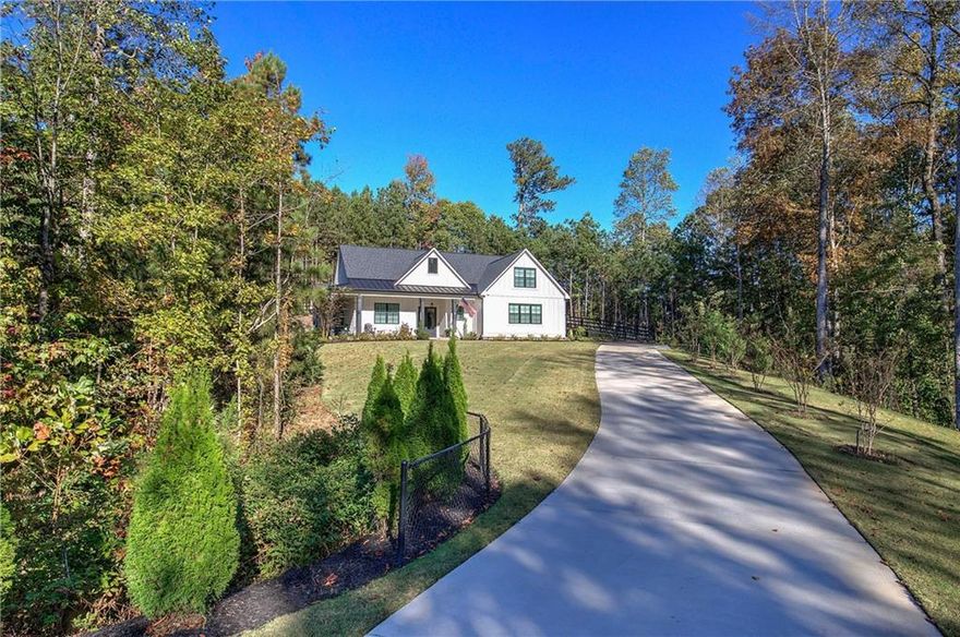 Immaculate Ranch Home on 1.69 Acres in Quiet Cul-de-Sac. Built in 2022 and meticulously maintained, this stunning ranch-style home offers single-level living with modern features and timeless charm. Perfectly positioned on a private 1.69-acre cul-de-sac lot, the property boasts a fenced backyard, whole house generator, and beautifully landscaped surroundings. Step inside to an open floor plan with gleaming hardwood floors and a spacious great room featuring a coffered ceiling and gas log fireplace. The gourmet kitchen includes a large walk-in pantry, ample cabinetry, stone counter tops, breakfast bar island, and a seamless flow into the living and dining areas—ideal for everyday living and entertaining. The primary bedroom suite is a true retreat with a spa-like full bath offering luxury finishes and generous space. Two guest bedrooms share a well-appointed full bath, and a separate home office/media room comes complete with its own full bath, providing flexible living options. Additional highlights include: Covered front porch that wraps around to the side; Back deck with built-in grilling station overlooking the private yard; Mud room for convenient entry and storage; Tankless water heater for efficiency; cement pad and electrical to accommodate a future hot tub. With immaculate condition and high-end features throughout, this home is move-in ready and designed for comfort, convenience, and style. Don’t miss the opportunity to own this exceptional property!