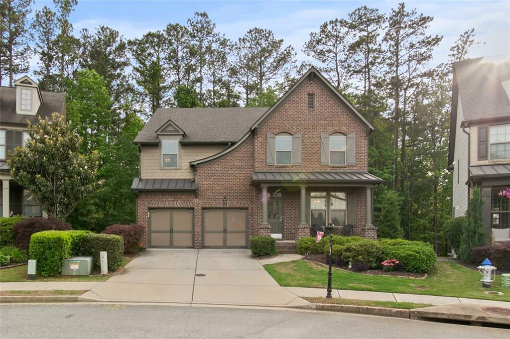 PRICE IMPROVEMENT!!! - MOTIVATED SELLERS - Welcome home to this spacious, one-owner home in Claremore Manor. Conveniently located off Hwy 92, awesome Cherokee County school district but minutes from Roswell. This home features 2 master suites, as well as main floor AND second floor laundry! Beautiful large kitchen with large island and extended table for extra seating! The fully finished basement provides ample opportunity, would make a great in-law suite or teen hang out with 2 living spaces, a bedroom, full bath, and kitchenette. This is a must see!!