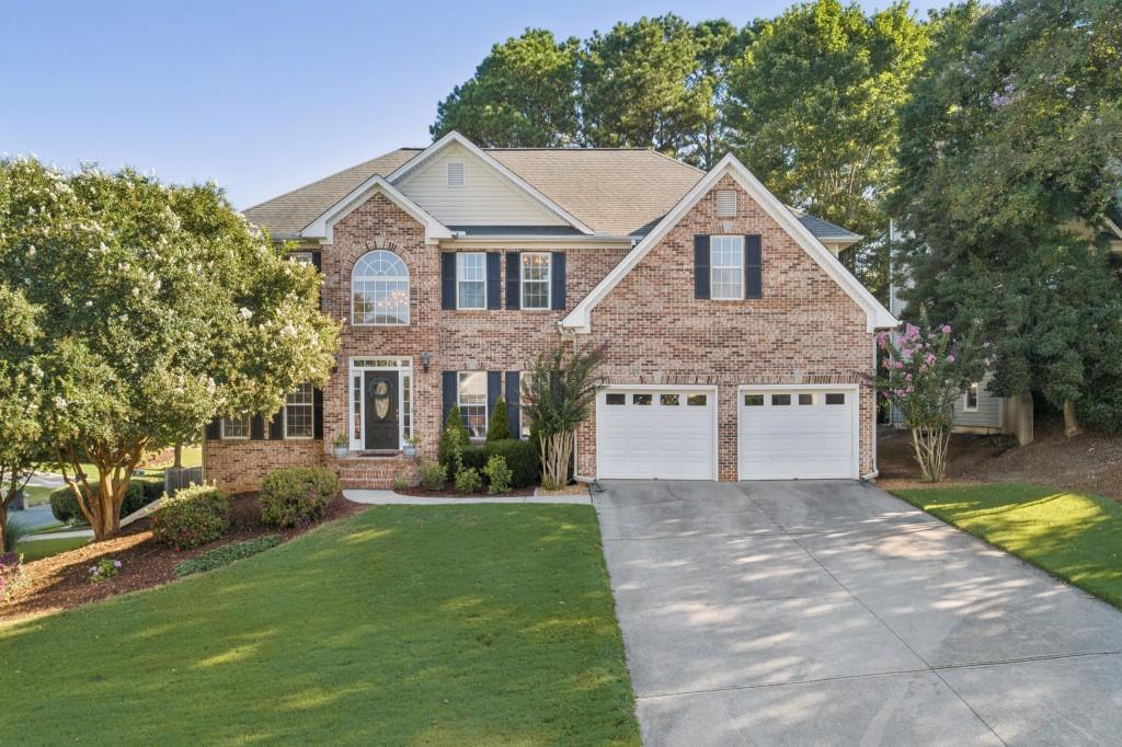 Explore this Stunning Estate-Style Home in Alexander Farms! Step into luxury living in this beautifully updated home boasting a separate 1 Bed/1 Bath In-Law Suite Apartment with its own entrance, adding both convenience and income potential. Nestled on a corner lot in the coveted Alexander Farms Community, this residence stands out as one of the largest and is in the prestigious Hillgrove High School District. The exterior charms with a lush front yard and meticulously landscaped surroundings featuring Crape Myrtles, Boxwoods, and blooming bushes, enhancing the curb appeal. As you enter, a well-lit two-story foyer welcomes you with gleaming hardwood floors, a grand staircase, and exquisite crown molding. To your left, you'll find a Formal Living Room (perfect for a Home Office/Library), and to your right, a Formal Dining Room with Wainscoting Walls that seamlessly flow into the Fireside Family Room. The heart of the home, the updated chef's kitchen, is a true masterpiece with Shaker Dove Soft-Close Cabinets, top-of-the-line stainless-steel appliances, Quartz countertops, and elegant brass finishes. Adjacent, a sunlit breakfast nook offers a charming space for casual dining or enjoying morning coffee. On the upper level, the oversized Owner's Suite impresses with a tray ceiling, a sitting area featuring a modern stone fireplace, and dual walk-in closets. The spa-like ensuite bathroom boasts a double vanity, soaking tub, and separate shower. Additionally, three more bedrooms and two full bathrooms provide ample space for family, guests, or a home office. The fully finished daylight basement adds versatility with a self-contained Apartment/In-Law Suite offering a private entrance, full kitchen, laundry room, bath, and separate garage. Whether for extended family or rental income, this space offers limitless possibilities. Outside, enjoy the meticulously landscaped, fully fenced backyard with a generous deck, updated fire pit, and ample room for outdoor activities, gardening, and entertaining!