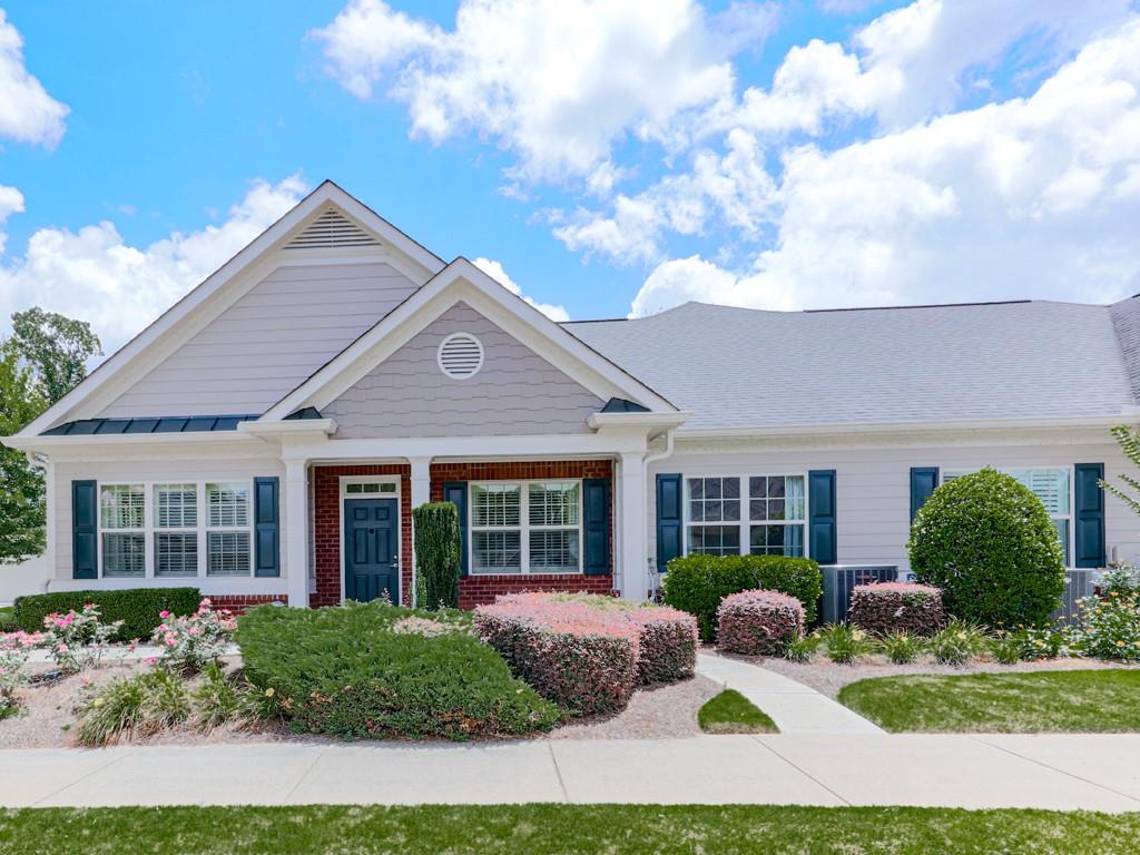 Welcome to the highly sought after, Orchards of East Cherokee!
Discover easy, one-level living in this warm and inviting 2-bedroom, 2-bathroom home in the heart of Hickory Flat. Located minutes from downtown Canton, Woodstock, and Northside Cherokee Hospital, this friendly and active community offers the perfect blend of convenience and comfort.
This spacious home features an open floor plan with a large living area, a separate dining room ideal for entertaining, and a bright flex space with two walls of windows—perfect for a sunroom, reading nook, or hobby room. The oversized primary suite offers a generous walk-in closet and a large bathroom, while the guest bedroom and bath provide privacy and comfort for visitors.
Enjoy added bonuses like a full-sized laundry room equipped with a washer and dryer, a 2-car garage with permeant stairs to ample storage space above. This home also provides low maintenance living with lawn care handled for you.
A short walk across the street to the community center offers wonderful amenities including a pool, and walking paths, with regular gatherings and events that make it easy to connect with neighbors.
Don’t miss your chance to enjoy a vibrant lifestyle in one of Hickory Flat’s most desirable 55+ communities—The Orchards of East Cherokee!