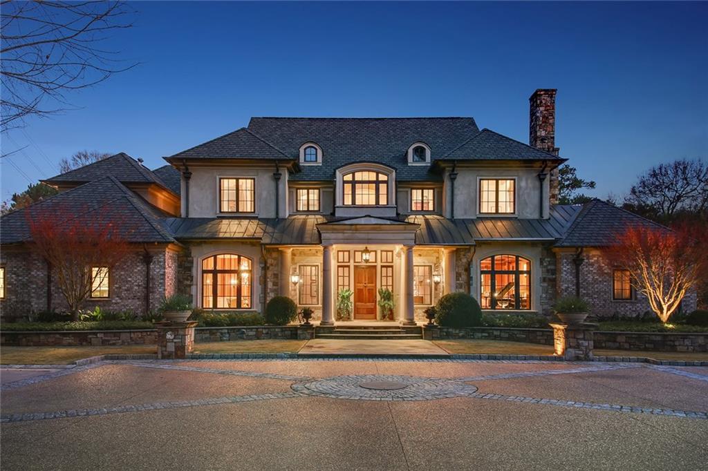 Luxurious retreat on 2.5 acres offering fine finishes, privacy, incredible outdoor spaces and fabulous location in family neighborhood with lake. Features chef's kitchen, open flow, lovely pool area with outdoor kitchen, fireplace and multiple seating areas. Grounds are landscaped with gardens, fountain and beautiful hardscape. Very liveable with gorgeous master on main, ensuite secondary bedrooms upstairs, pool bath, terrace level with full bath and a detached in-law suite. Creston whole house system, well for irrigation, steam shower and so many other amenities.