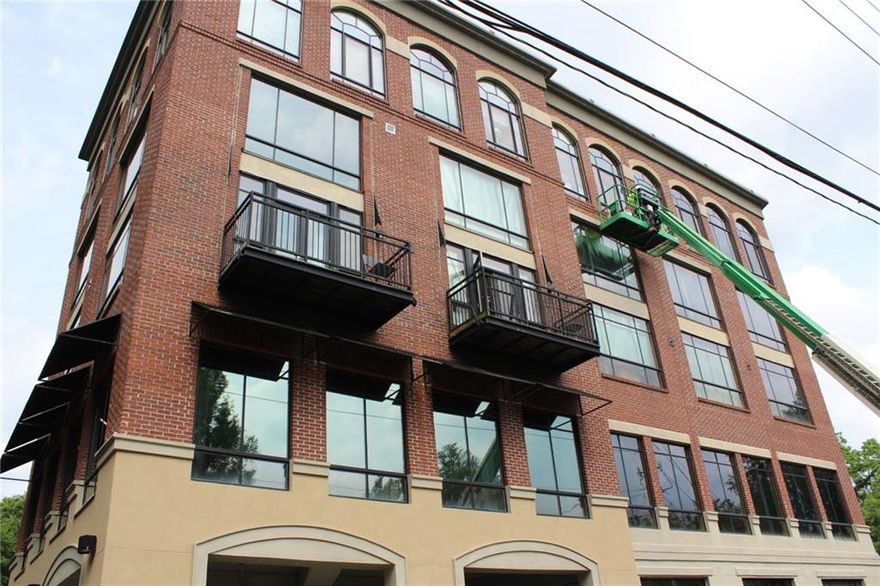 Amazing two-story loft with 2 bedrooms in the heart of Marietta! Perfect mix of urban, contemporary, and modern design in this open floor plan w/exposed brick walls and concrete floors. The renovated kitchen boasts gorgeous granite countertops, brick backsplash, huge island w/breakfast bar and stainless-steel appliances. Large walk-in pantry with custom shelving. Freshly painted interior and polished concrete floors. Gated and covered parking plus storage unit. Enjoy the roof top deck with views of the city. Walk to Marietta Square! Marietta Square has so much to offer including Marietta Square Market Food Hall, Glover Park Brewery, Taqueria Tsunami, Douceur de France French Bakery & Café, Kiosk, Two Birds Taphouse, and so much more. Also, enjoy the Friday Art Walks in the Square, Glover Park Concert Series, Farmers Market every weekend, and tons of art & music events throughout the year! Fitness center is located on Level M. There is a full gym with lockers and shower available 24/7 on 2nd floor for all owners. In addition, you can jump on the elevator to the top floor where there is a rooftop deck with outdoor seating for those loving views of downtown Marietta and Kennesaw Mountain. The rooftop deck is the perfect spot for inviting clients/guests for lunch or happy hour to enjoy those great views or all the fireworks on 4th of July! Roof top deck is on 5th floor. There is a staircase on the side of the building that leads to the units too. This unit has one designated parking space and one designated storage. The unit has 2 balconies.