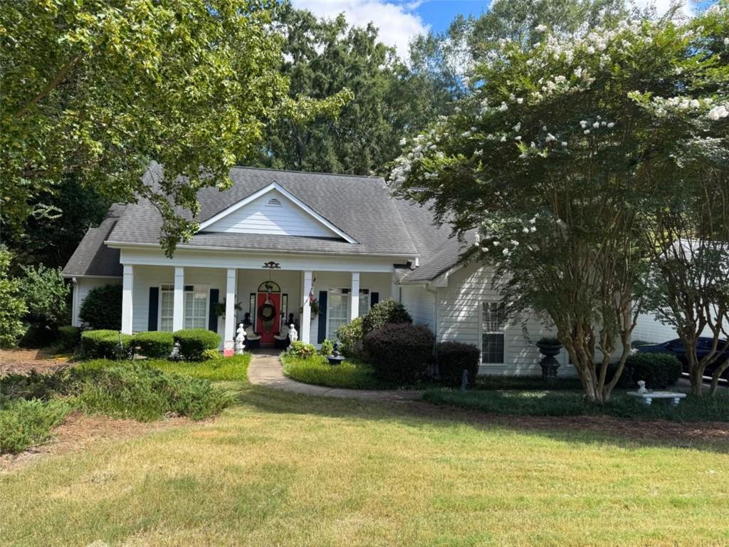 Welcome to this charming Southern Traditional Ranch-style home, perfectly situated just 5 minutes from downtown Monroe. Nestled in a picturesque neighborhood filled with mature hardwoods and timeless appeal, this residence offers both comfort and convenience. The thoughtfully designed split-bedroom floor plan features a spacious primary suite complete with a large en-suite bathroom. You'll also find a formal dining room, a generous utility/laundry room, and a versatile office space ideal for working from home, hobbies, or even a guest room. From the moment you step inside, the soaring ceilings and open layout create an elevated sense of space and luxury. This home truly combines elegance with functionality - perfect for both everyday living and entertaining.