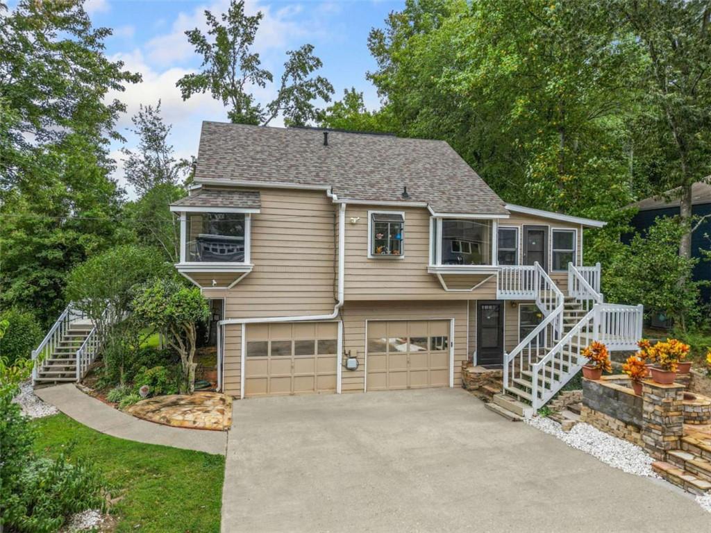Welcome to this stunning 5-bedroom, 3-bath home, perfectly situated on a peaceful cul-de-sac in the highly sought-after East Cobb area of Marietta! Boasting an open-concept floor plan, the inviting family room features a cozy fireplace, ideal for gatherings or relaxing evenings. The large kitchen comes complete with stainless steel appliances and plenty of room to add an island, giving you the flexibility to create your dream culinary space. One of the home's highlights is the extended theatre and relaxation room across from the first floor master bedroom. The home also features a lower lever bedroom, accessed on one side by a unique spiral staircase, with its own private exit to the fountain area. Work from home or unwind in the sun-drenched sunroom, currently used as a relaxation center or home office or relaxation. There is also a private, secluded functional office off of the garage. Set on a large corner lot, this property is a gardener's and entertainer's dream, featuring a greenhouse, exotic tropical fruit trees, a serene water fountain, and beautifully landscaped grounds. Located in prestigious East Cobb, you'll enjoy access to top-rated schools, upscale shopping, and recreation just minutes away. Bonus: All furnishings and even the two automobiles are negotiable with the sale! Up to $34,950 in Down Payment Assistance available to qualified buyers through our Preferred Lender - making this an incredible opportunity! Don't miss out - schedule your private showing today!