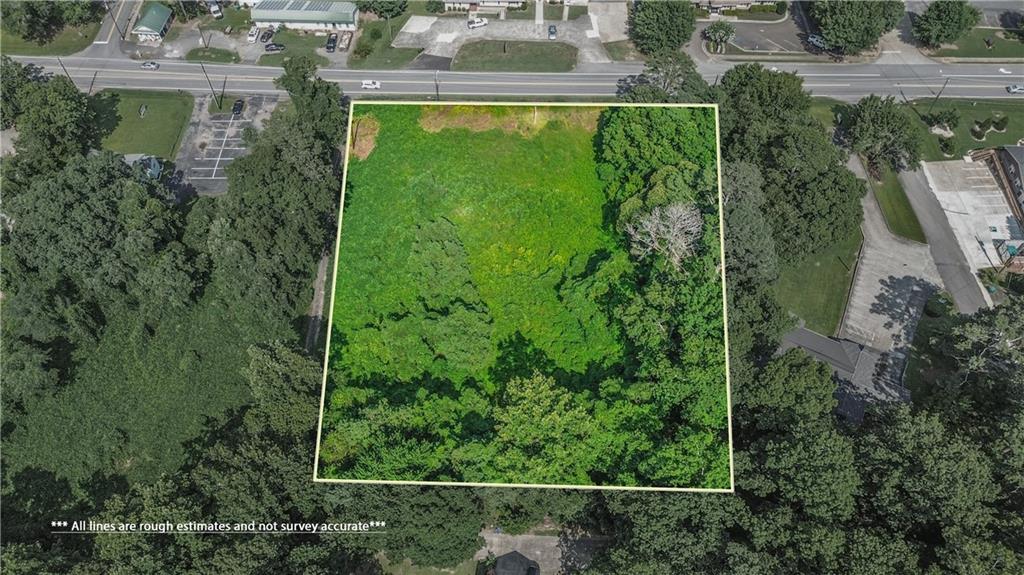 Highly visible commercial property on 1.63 acre lot! Excellent visibility on Marietta Hwy with high traffic counts. The property is zoned General Commercial. The property offers 234 FT of road frontage on Marietta Hwy. Perfect location for Offices on the front and a full basement that can be accessed in the back. This property is located less than 1.5 miles to Interstate 575 at exit 14. Northside Cherokee, Canton Marketplace and Interstate 575 (at exits 14 and 16) are less than 5 minutes away.