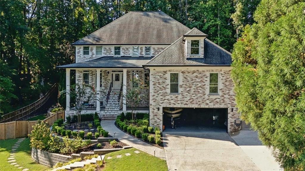 OWNER FINANCING AVAILABLE WITH A 30% DOWN PAYMENT: This stunning 7-bedroom, 6-bathroom custom-built home has been meticulously upgraded with luxury renovations, offering an exceptional blend of elegance, functionality, and modern convenience. Nestled on 0.47 private acres in a sought-after swim community, this home is just minutes from Historic Marietta Square, Kennesaw Mountain National Battlefield Park, major roads, and top-tier shopping. Step inside to discover a thoughtfully designed layout featuring two kitchensCoone on the main level and another in the basementCoboth adorned with premium granite countertops. The main level offers an open-concept eat-in kitchen, a formal dining room that accommodates up to 12 guests, a spacious family room with a cozy fireplace, and one versatile bonus roomCoperfect for offices, playrooms, or additional guest space. The two-story living room adds to the home's grandeur, while plenty of closets throughout provide ample storage. The top floor boasts three spacious bedrooms, including a luxurious primary suite with dual walk-in closets, a soaking tub, and a beautifully remodeled spa-like bathroom. The additional upstairs bedrooms each have their own private en suite baths, ensuring ultimate privacy and convenience. The fully finished basement is a showstopper, featuring a separate entrance, a full commercial-grade kitchen, a private movie room with a kitchenette, a full bath, and newly installed vinyl flooring. The basement offers 2 well-distributed bedrooms, 1 additional full bathroom, and a living room with exterior private entry and additional areas to be used as storage, especially for rent and extra income. Whether used as a private guest suite or income-generating rental, this space offers incredible flexibility. Recent Upgrades & Features: Roof replaced just 3 years ago, Brand new basement water heater (1 month old) & main house water heater (2 years old), Professionally remodeled bathrooms with luxurious finishes, Fresh exterior lime-wash (6 months old) & interior paint (2 years old); New ceramic flooring installed just 1 month ago, Meticulously maintained HVAC system " last serviced 2 months ago", Extended driveway from the street to the side of the home for added convenience, Beautiful professional landscaping work, and new fence were performed just one and half year ago, perfect location in a serene stream running through the property, Located in an excellent, safe neighborhood with low or no crime, Low-cost HOA. Easy access to nature trails and a little creek crossing the lot behind the building. With soaring 14-foot ceilings, a perfect mix of hardwood, ceramic, carpet, and vinyl flooring, and abundant natural light throughout, this home offers an unparalleled blend of luxury and comfort. Don't miss out. Schedule your private showing today before it's gone!
