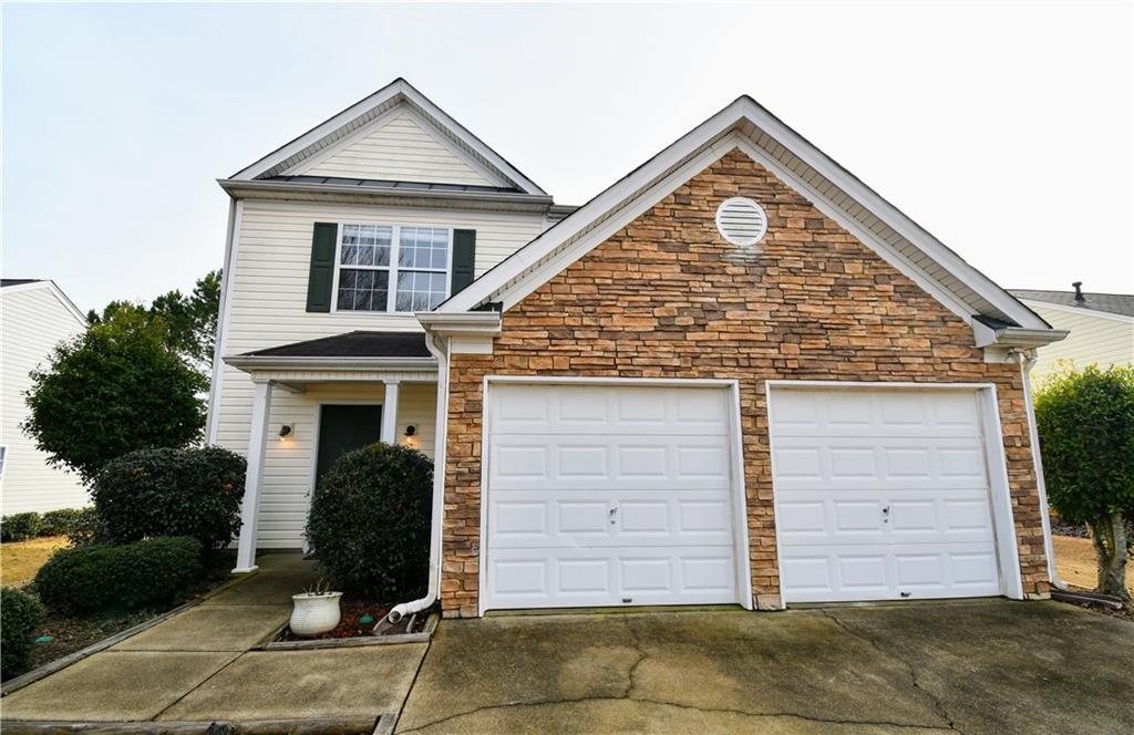 Very well-kept 3 bedroom 2.5 bath home in sought-after Carrington Farm! This light-filled home features gorgeous hardwoods throughout, along with open-concept kitchen complete with stainless appliances. Step outside to your spacious backyard with patio perfect for grilling! Upstairs leads to a fabulous master bedroom and bath, with double vanity and large walk-in closet. Walk to the community pool and tennis courts for relaxing summer days. All of this just minutes to shopping, dining and schools of Hickory Flat! Available for Oct. 1st move-in!
