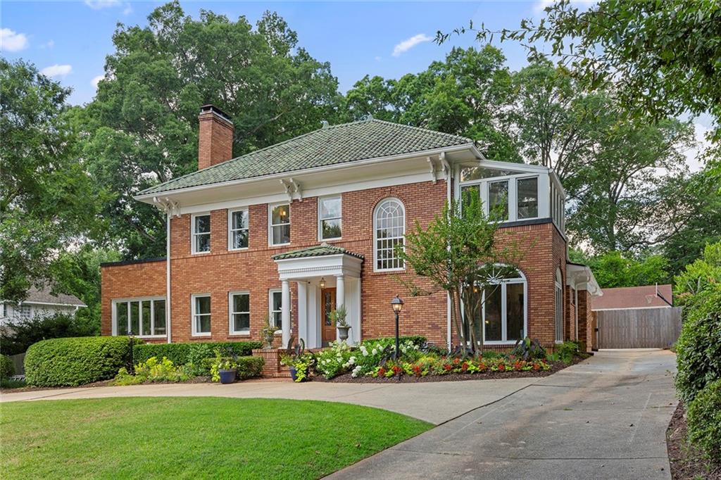 Discover elevated living in this exquisitely renovated 1925 estate, nestled on a rare half-acre lot in Atlanta’s prestigious Druid Hills neighborhood. Thoughtfully restored with over $400,000 in enhancements, this residence is a seamless blend of original architectural charm and sophisticated modern living.
Designed by acclaimed architect Leila Ross Wilburn and set within a neighborhood envisioned by famed landscape architect Frederick Law Olmsted, the home lies in one of Atlanta’s most storied enclaves—once home to Coca-Cola founder Asa Candler.
At the heart of the home, the chef’s kitchen impresses with a 48” Wolf Range, custom cabinetry, and a 12' x 12' butler’s pantry—perfectly appointed for entertaining. The grand living room is anchored by a stately fireplace and framed by views of the expansive backyard, while the elegant dining room opens directly onto a spacious deck overlooking a sparkling pool, complete with updated equipment and an automatic pool cover.
The luxurious primary suite offers its own fireplace and spa-inspired bath with soaking tub and oversized shower. Five full bathrooms and a powder room are beautifully appointed, complemented by a sun-drenched main floor sunroom and multiple outdoor living spaces designed for effortless indoor-outdoor flow.
With over 4,000 square feet of living space plus a separate guest house—ideal as an office, in-law suite, or income-producing rental—this home offers unmatched versatility. Smart home features include a WiFi-controlled irrigation system, and a rare three-car garage enhances everyday convenience.
Situated beside one of only eight twittens in Druid Hills, this prime location offers easy access to Downtown, Midtown, and Decatur. Walk to Emory University and Hospital; CDC and Children’s Healthcare are just minutes away.
This is where historic prestige meets modern luxury—an exceptional opportunity in one of Atlanta’s most coveted neighborhoods.