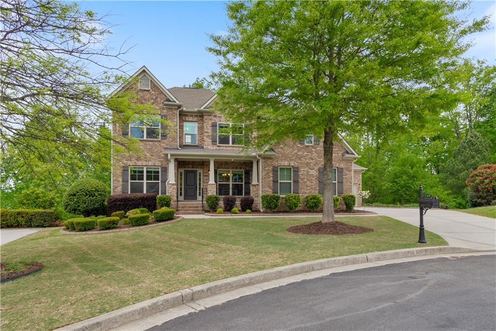 Welcome home to this beautiful cul-de-sac home in the gated community of Kendrix Ridge which feeds into North Gwinnett HS/Riverside Elementary school districts (Best in Gwinnett County)! Showings will begin at noon on Friday the 3rd. Can you say, "curb appeal"? Beautiful landscaping, freshly laid sod, and new exterior paint welcome you as you walk up to the rocking chair front porch. Come on inside and you will immediately notice that this home has been freshly painted and has beautiful (new) engineered hardwood floors. Enjoy entertaining in your dining room with wainscoting and tray ceiling. A sitting room/office/playroom is located to the left of the front door to customize to the needs of your family. Don't miss the first floor bedroom or in-law suite complete with an attached ensuite bathroom. Come on into the great room which boasts a beautiful shiplap feature wall with fireplace and is open to the newly renovated kitchen. This kitchen is a family's dream with beautiful shaker cabinets, leathered granite countertops, lazy Susans and drawer stacks to your hearts content! A large walk-in pantry rounds out this ideal kitchen. As you enter the kitchen from the three car garage, you will find a drop-zone for coats and backpacks and the laundry room to your right. Come on out to the screen porch off the kitchen and relax and watch the birds and deer in the wooded area behind the house. Upstairs you will find four additional bedrooms, 3 full bathrooms and a loft area to suit your needs. The oversized primary bedroom boasts a beautiful vaulted ceiling and a view to the wooded back yard. The primary ensuite bathroom has a dual vanities, separate shower and tub and 2 large walk-in closets! But wait, there's more! You have to check out the newly finished terrace level with ceramic tile floors! It was built as an in-law suite so it contains a large family room area in additional to a large bedroom and full bath. There is an unfinished space that could be the perfect workshop, exercise area or playroom depending on your needs! This lovely home has it all and is waiting for the perfect owner to make it theirs!