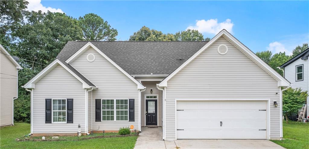 Beautifully maintained 3 bed, 2 bath ranch in a prime Lawrenceville location with NO HOA—perfect for first-time buyers, downsizers, or investors! This move-in-ready home features vaulted ceilings, recessed lighting, and a popular roommate-style floor plan. The open concept layout includes 10+ ft ceilings and seamless flow from the kitchen to the living and dining areas, ideal for entertaining. The private owner’s suite offers a walk-in closet and full bath, while two secondary bedrooms are positioned on the opposite side for added privacy. Sitting on a spacious 0.31-acre level lot, this home offers generous front and back yards—perfect for outdoor entertaining, gardening, or future expansion. Includes a 2-car garage and extended driveway. Conveniently located minutes to Downtown Lawrenceville, Sugarloaf Pkwy, Hwy 316, GA-20, parks, shopping, dining, and top-rated Gwinnett schools.