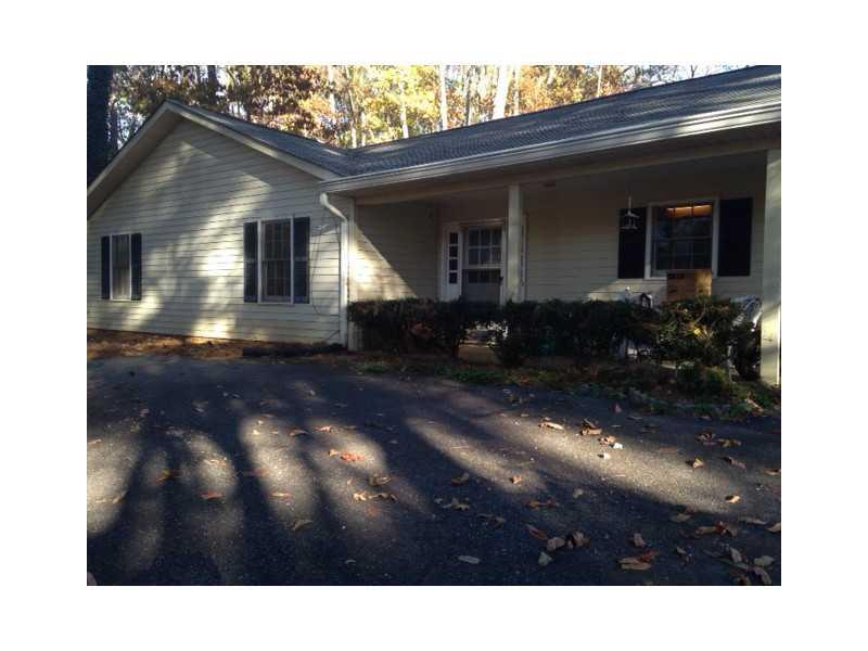 AWESOME LOW MAINTENANCE VINYL SIDING RANCH W/ 3 BEDROOMS AND 2 BATHS. LAMINATE WOOD FLOORS AND WOOD BURNING FIREPLACE IN LIVING ROOM. LARGE OPEN SUNROOM. PRIVATE WOODED LOT.