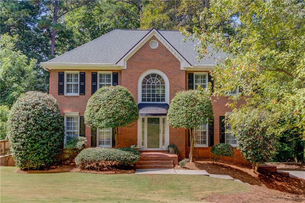 Fantastic Opportunity to Live in a Prime Roswell Location in Highly Sought-After Inverness Subdivision! Welcome to this beautiful 3-sided brick home with a great floor plan. Enter into the 2 story Family Room with floor to ceiling windows, letting in tons of natural light, and featuring a gas log fireplace and built-in bookshelves. The Family Room extends into the light and bright Sunroom with spectacular views to the natural backyard. The Kitchen is spacious and features a breakfast bar and newer stainless steel double ovens. Enjoy your meals in the eat-in kitchen area overlooking the private backyard. There is a bedroom/office with a full bath on the main level as well as a spacious dining room. Upstairs you will find the Owner’s Suite, 2 walk-in closets, and a large vaulted ceiling bathroom with double vanities, a soaking tub, and a renovated shower. Two additional bedrooms are upstairs and share a full bath. The laundry area completes the upstairs. The basement has a finished room and lots of storage space! Could definitely finish the basement for more living space. Tiered decking and a screened porch are perfect for grilling and entertaining. Inverness is an active swim/tennis community featuring a Jr Olympic pool, tennis courts, a playground and a clubhouse. The area amenities are phenomenal -- the Chattahoochee Nature Center, the Roswell Riverwalk along the Chattahoochee River, and Roswell's Historic Square featuring many charming shops and restaurants. Roswell is one of the most desirable cities in the metro Atlanta area. Easy access to GA 400. Award winning schools.