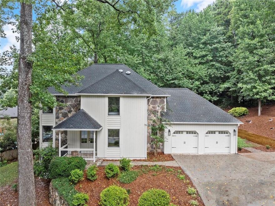 Prepare to be captivated by this beautifully renovated gem in one of East Cobb’s premier swim and tennis communities. Nestled in a cul-de-sac with easy access to top-rated amenities, this home welcomes you with a professionally landscaped yard, tiered garden beds, newer garage doors, and a charming covered porch. Inside, high-end updates and thoughtful design shine throughout, delivering the style and quality of a new build. Enjoy a beautifully reimagined open-concept layout where modern design meets effortless functionality. The seamless flow between the kitchen, dining, and living spaces is perfect for everyday living and easy entertaining.
The fully remodeled interior boasts white oak hardwoods, fresh carpet, designer lighting, updated trim, and fresh paint inside and out. The chef’s kitchen features white shaker-style cabinets, an oversized island with drawer storage, Taj Mahal quartzite countertops, a large single-basin sink, and premium stainless-steel appliances—including a 36” gas range, custom vent hood, dishwasher, and built-in microwave. Recessed and statement lighting add the perfect designer touch. Relax fireside in the family room with a sleek new marble surround or step out onto the spacious, newly built deck, ideal for hosting unforgettable gatherings. A newly added half bath completes the main level. Upstairs, retreat to the oversized primary suite with vaulted ceiling, new flooring and lighting, and a luxurious bathroom with tiled shower, double vanity, black matte fixtures, and a walk-in closet. Three additional bedrooms share an updated bathroom with double sinks and a tub/shower combo. Downstairs, the finished terrace level includes a wine bar, large rec/media room, a full bath and bedroom, and ample storage, perfect for guests, teens, or an in-law suite. The backyard offers room to relax or play, with a firepit and space for outdoor fun. Enjoy neighborhood perks like 2 event pavilions, a newly remodeled pool, 4 brand-new tennis courts, a multi-purpose court for pickleball and basketball, and a playground. With award-winning schools and year-round community events, this home truly has it all. Don’t miss your change to own this renovated stunner in one of East Cobb’s most desirable communities.