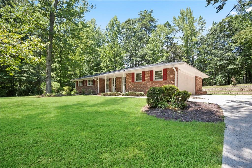 Fall in love with this move-in ready 3 bedroom, 2 bath home located in a quiet Fairburn neighborhood. This updated brick ranch offers a perfect blend of charm and modern convenience. Featuring a spacious front yard and a beautifully landscaped backyard, the property sits on a little over 0.5-acres—ideal for outdoor entertaining, gardening, or simply relaxing.
Inside, you’ll find fresh paint, stylish light fixtures, and brand-new appliances. Recent updates include a 3-year-old roof and a 5-year-old water heater, providing peace of mind. A 2-car garage and 4-sided brick construction add value and durability.
This Fairburn home offers easy access to schools, shopping, dining, and major highways, making it an excellent choice for families, first-time buyers, or anyone looking for a fully renovated brick home with a big yard in a peaceful setting. Don’t miss your chance to make this beautifully updated brick home yours—schedule your showing today and fall in love with everything it has to offer!
